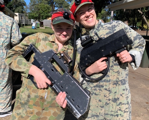 volunteer and participant at outdoor laser tag